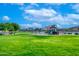 Community playground with play structures, swings, and a covered picnic area at 17316 W Seldon Ln, Waddell, AZ 85355