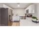 Modern kitchen with stainless steel appliances and white cabinets at 1739 E Pleasant Ln, Phoenix, AZ 85042