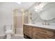 Updated bathroom with double vanity, new shower, and round mirrors at 1818 E Monterey Way, Phoenix, AZ 85016