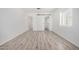 Bright bedroom with vinyl plank flooring and barn door at 1818 E Monterey Way, Phoenix, AZ 85016