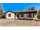 White single story home with carport and spacious front yard at 1818 E Monterey Way, Phoenix, AZ 85016