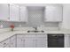 Clean kitchen with white cabinets, double sink, and modern dishwasher at 1818 E Monterey Way, Phoenix, AZ 85016