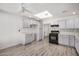 Bright kitchen featuring white cabinets, modern appliances, and a skylight at 1818 E Monterey Way, Phoenix, AZ 85016