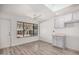 Updated kitchen with white cabinets and wood flooring at 1818 E Monterey Way, Phoenix, AZ 85016