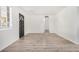 Light and airy living room with dark door and hardwood floors at 1818 E Monterey Way, Phoenix, AZ 85016