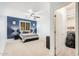 Bedroom with ceiling fan and ensuite bathroom at 27906 N Sierra Sky Dr, Peoria, AZ 85383