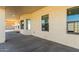 Covered back patio with concrete flooring and access to the backyard at 30124 W Mckinley St, Buckeye, AZ 85396