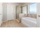 Bathroom with a bathtub, shower, and tile flooring at 30124 W Mckinley St, Buckeye, AZ 85396