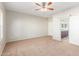 Large bedroom featuring a ceiling fan and barn door at 30124 W Mckinley St, Buckeye, AZ 85396