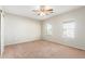 Spacious bedroom with neutral walls and carpet, ceiling fan, and window blinds at 30124 W Mckinley St, Buckeye, AZ 85396