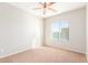 Well-lit bedroom with neutral walls, carpet, ceiling fan and window at 30124 W Mckinley St, Buckeye, AZ 85396