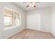 Bedroom with neutral walls, carpet, window blinds, and sliding door closet at 30124 W Mckinley St, Buckeye, AZ 85396