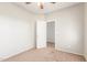 Bright bedroom with neutral walls, carpet, and ceiling fan at 30124 W Mckinley St, Buckeye, AZ 85396