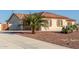 House with a palm tree and desert landscaping at 30124 W Mckinley St, Buckeye, AZ 85396