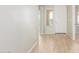 Light-toned hallway with wood-look flooring at 30124 W Mckinley St, Buckeye, AZ 85396