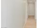 Long hallway with light walls and tile flooring at 30124 W Mckinley St, Buckeye, AZ 85396