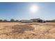 Single story home with storage and carport in the back at 30124 W Mckinley St, Buckeye, AZ 85396