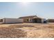 Single story home with carport and storage container at 30124 W Mckinley St, Buckeye, AZ 85396