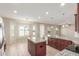Island kitchen with granite countertops and stainless steel appliances at 30124 W Mckinley St, Buckeye, AZ 85396