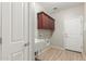 Laundry room with cabinets and exterior access at 30124 W Mckinley St, Buckeye, AZ 85396