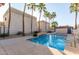 Community pool with palm trees and lounge chairs at 3221 N 37Th St # 26, Phoenix, AZ 85018