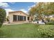 Landscaped backyard with artificial turf and a view of the home at 3291 E Cherrywood Pl, Chandler, AZ 85249