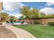 Landscaped backyard with a brick pathway leading to the pool at 3291 E Cherrywood Pl, Chandler, AZ 85249