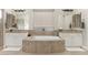 Spa-like bathroom with a large soaking tub and double vanity at 3291 E Cherrywood Pl, Chandler, AZ 85249
