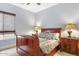 Bedroom with sleigh bed and hardwood floors at 3291 E Cherrywood Pl, Chandler, AZ 85249