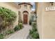 Inviting entryway with a paved walkway, lush landscaping, and a charming wooden door at 3291 E Cherrywood Pl, Chandler, AZ 85249