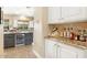 Kitchen features wine cooler and granite countertops at 3291 E Cherrywood Pl, Chandler, AZ 85249