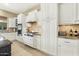 Spacious kitchen featuring white cabinetry, granite countertops, and stainless steel appliances at 3291 E Cherrywood Pl, Chandler, AZ 85249