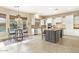 Kitchen features a large island, breakfast nook, and white cabinetry at 3291 E Cherrywood Pl, Chandler, AZ 85249
