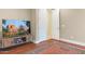 Living room with large TV and hardwood floors at 3291 E Cherrywood Pl, Chandler, AZ 85249