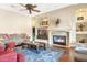 Bright living room featuring a fireplace and built-in shelving at 3291 E Cherrywood Pl, Chandler, AZ 85249