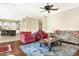 Spacious living room with hardwood floors, fireplace and kitchen view at 3291 E Cherrywood Pl, Chandler, AZ 85249