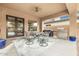 Covered patio with seating area, built-in grill, and access to backyard at 3291 E Cherrywood Pl, Chandler, AZ 85249