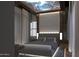 Spacious bedroom with a starlit ceiling and plush bedding at 46 W Palm Ln, Phoenix, AZ 85003