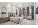 Spacious Primary bedroom with plush bed and sitting area at 46 W Palm Ln, Phoenix, AZ 85003