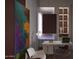 Home office with modern desk, shelving, and abstract art at 46 W Palm Ln, Phoenix, AZ 85003