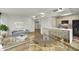 Open concept dining area with kitchen access and modern wood table at 4808 N 24Th St # 531, Phoenix, AZ 85016