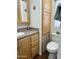 Bathroom with light wood cabinets, granite countertop, and a toilet at 7750 E Broadway Rd # 776, Mesa, AZ 85208