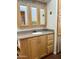 Bathroom featuring a vanity with granite countertop and wood cabinets at 7750 E Broadway Rd # 776, Mesa, AZ 85208