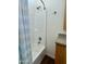 Bathroom with shower/tub combo, granite countertop, and wood cabinets at 7750 E Broadway Rd # 776, Mesa, AZ 85208