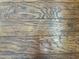 Dark brown wood-look laminate flooring at 7750 E Broadway Rd # 776, Mesa, AZ 85208