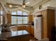 Bright kitchen with wood cabinets, granite countertops, and updated appliances at 7750 E Broadway Rd # 776, Mesa, AZ 85208
