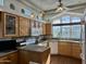 Spacious kitchen featuring light wood cabinets, granite countertops, and modern appliances at 7750 E Broadway Rd # 776, Mesa, AZ 85208