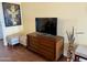 Living room features hardwood floors, media console, and comfortable seating at 7750 E Broadway Rd # 776, Mesa, AZ 85208