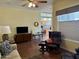 Bright living room with hardwood floors, comfy seating, and a view of the kitchen at 7750 E Broadway Rd # 776, Mesa, AZ 85208