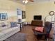 Spacious living room with hardwood floors and a TV at 7750 E Broadway Rd # 776, Mesa, AZ 85208